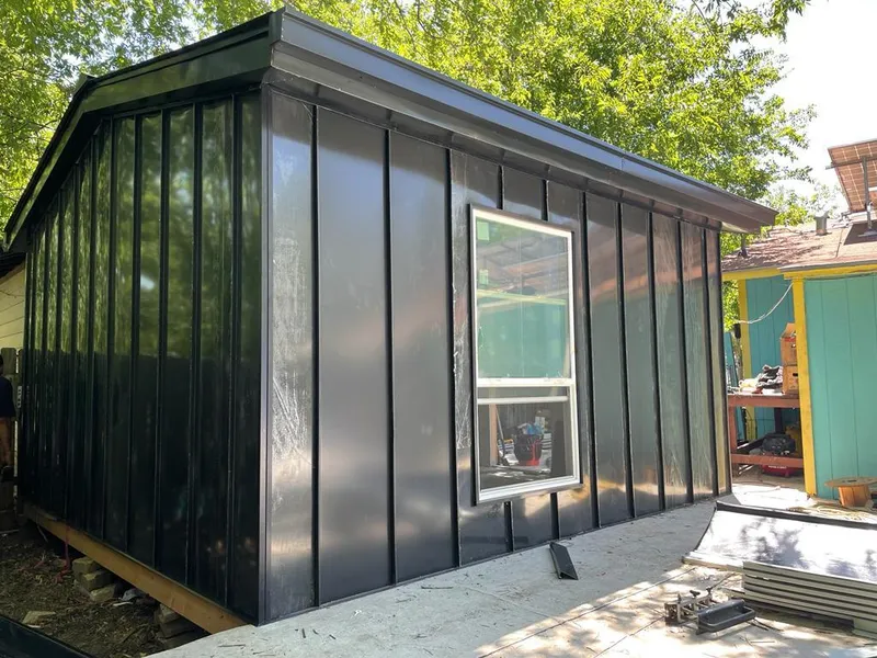 Black standing seam metal wall panels for Roof Inspection in New Iberia