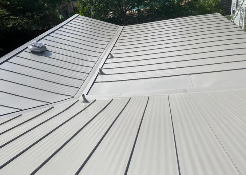 Solar attic fan installed on a metal roof for Roof Ventilation in New Iberia